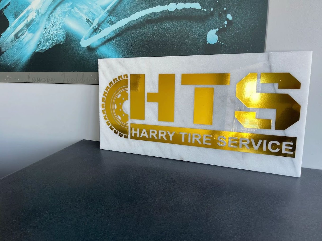 Harry Tire Service HTS logo plaque
