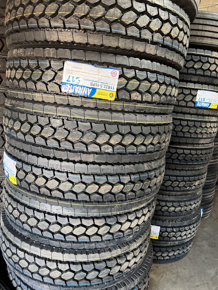 Large stacked tire inventory at Harry Tire