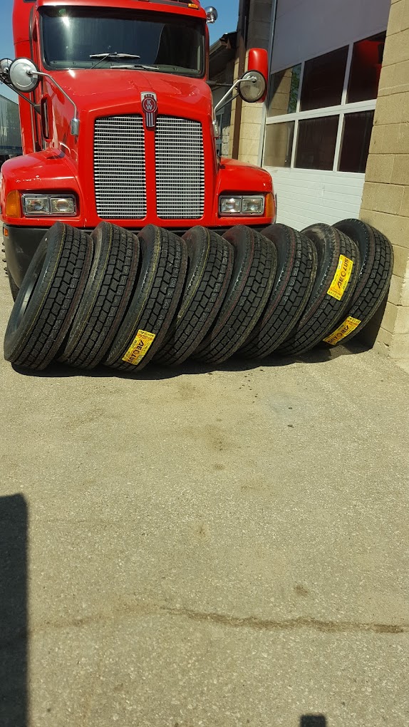 Truck tires lined up at Harry Tire Service